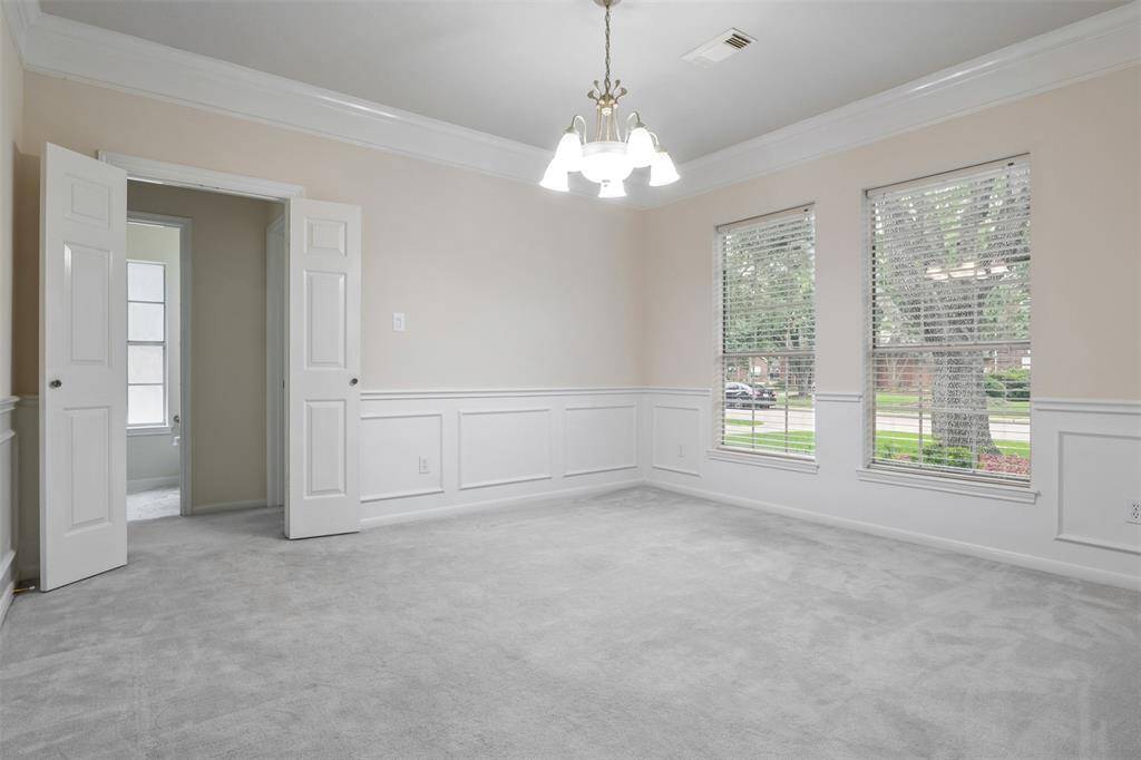 the formal dining room is conveniently located to your right as you enter through the front door. It’s an ideal space, freshly painted with soft, light-dimming controls, creating the perfect ambiance for any occasion.