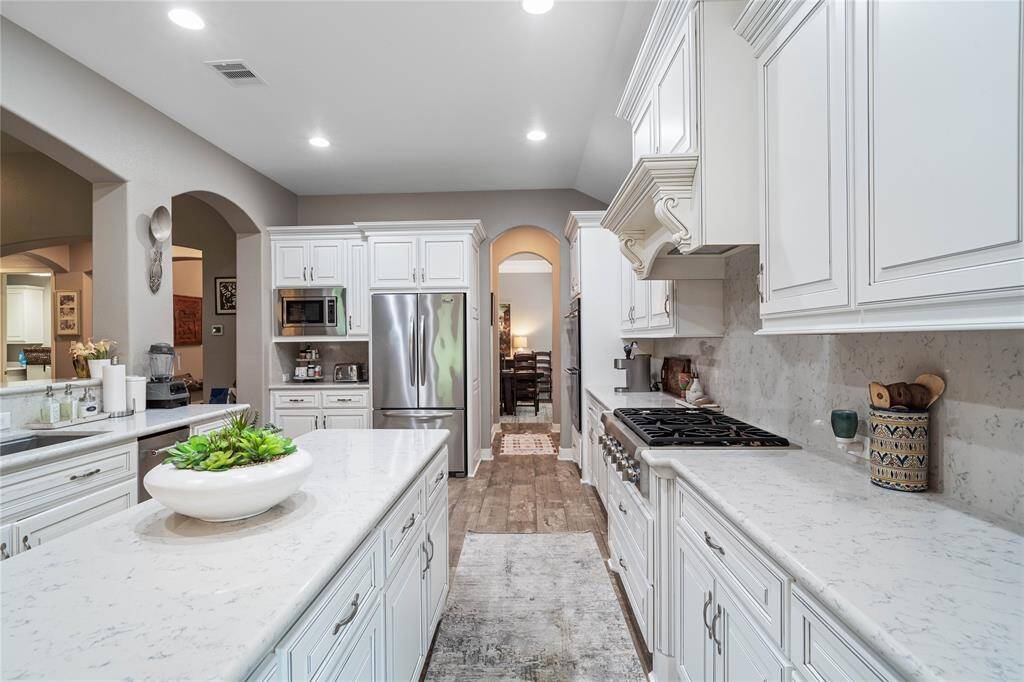 White on white kitchen is timeless and will accommodate any decor you go with.