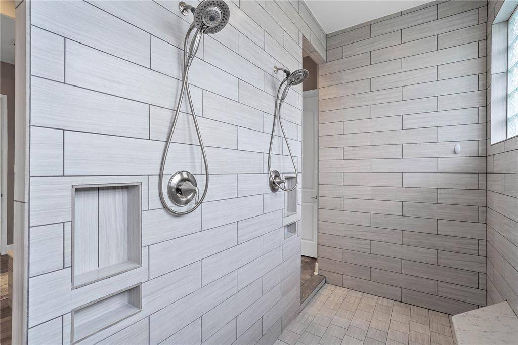 Huge walk-in tiled shower.