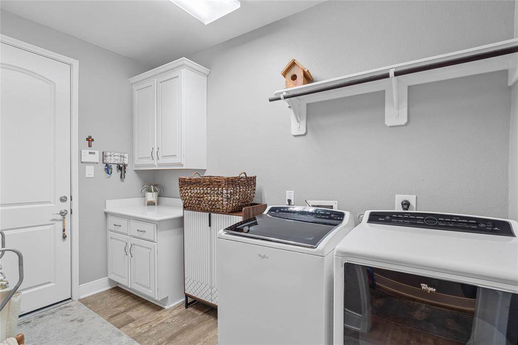 Laundry room features built-inshelving and storage.