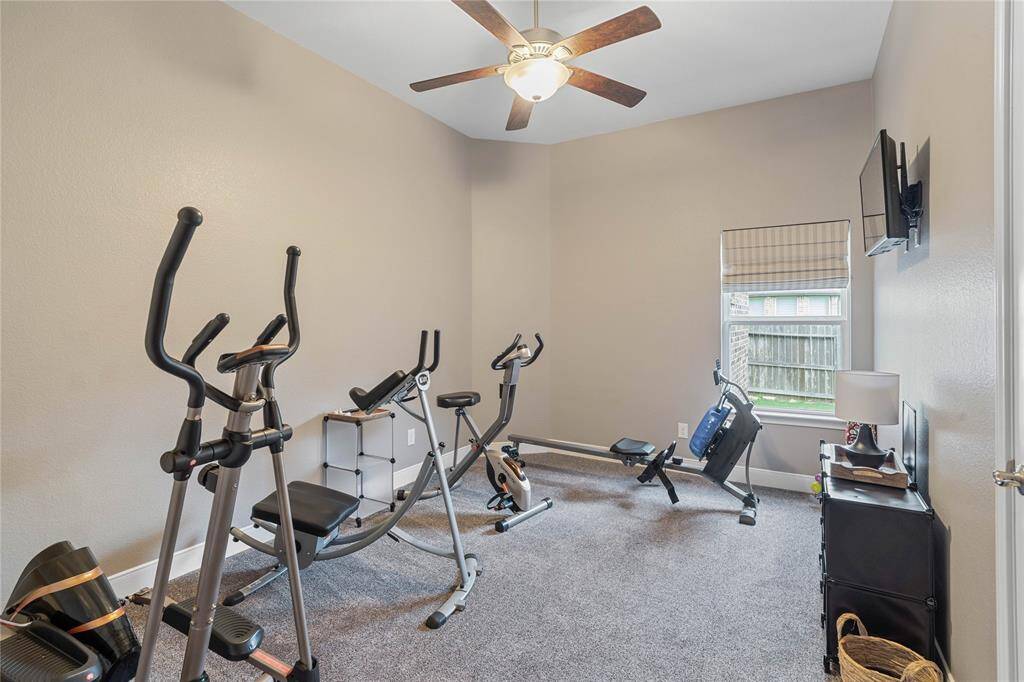 One of three secondary bedrooms currently set up as a home gym.