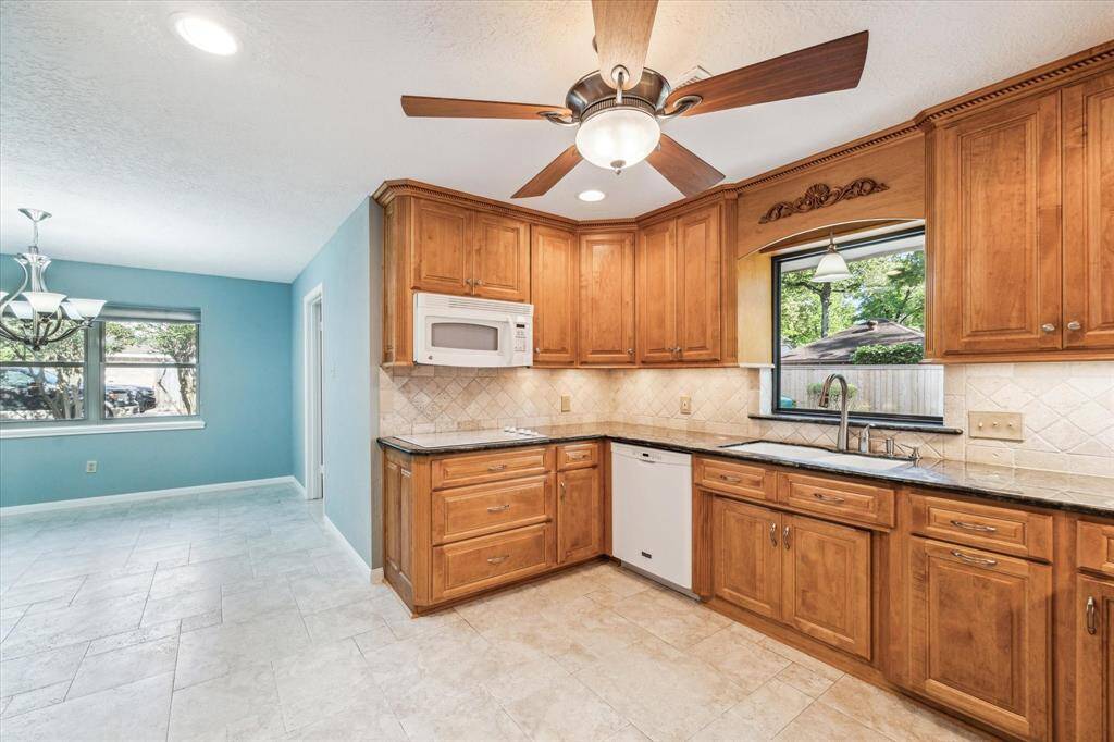 Granite counters, pots and pan drawers and deep sink with lovely window view