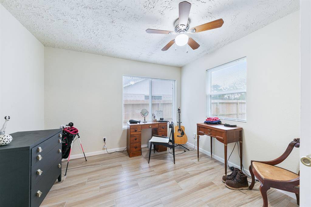 The secondary bedroom is located in the SW corner of the home, facing the back yard.