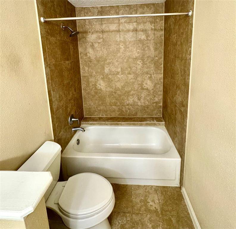 master bathroom tub and toilet