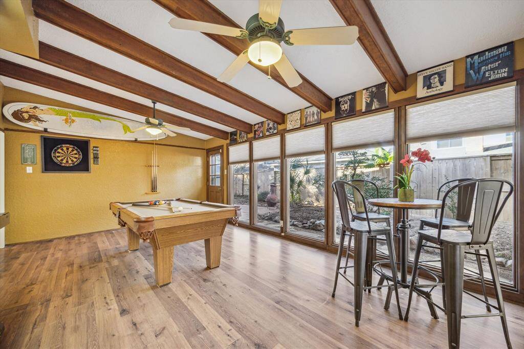 This versatile game room or sunroom is an entertainer's dream. Turn this space into party central with its expansive layout, offering plenty of room for your game table, big screen, and seating for everyone.