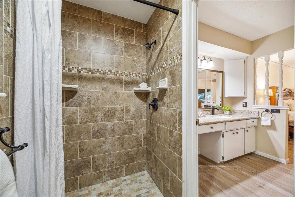 The owner’s ensuite bathroom also offers a large walk-in shower with beautiful tile work.