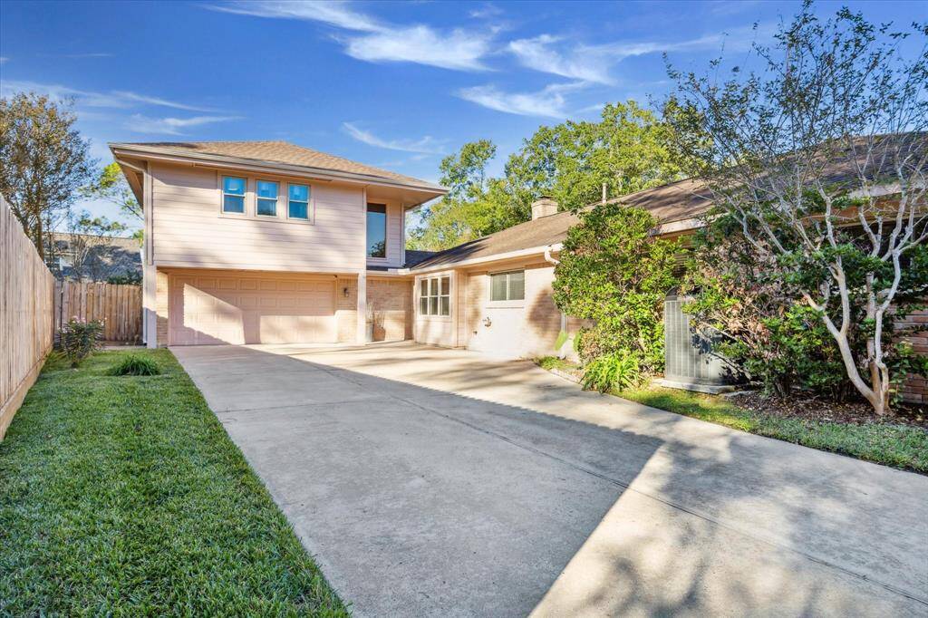Be welcomed home with outstanding curb appeal with a lush lawn, mature landscaping, and a two-car garage.