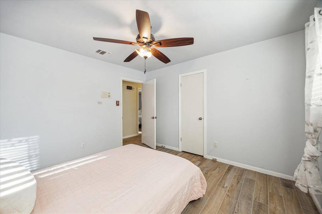 An alternate view of the spacious guest bedroom shows plenty of floor space for furniture, games, toys, and more.