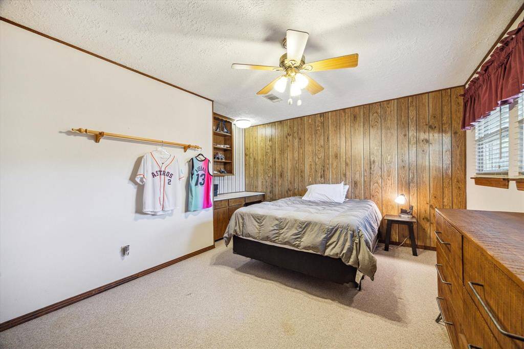 An alternate view of the bedroom in the guest quarters shows plenty of space for large furnishings and a built-in desk. Bring your design ideas to life, you’ve got a great start!