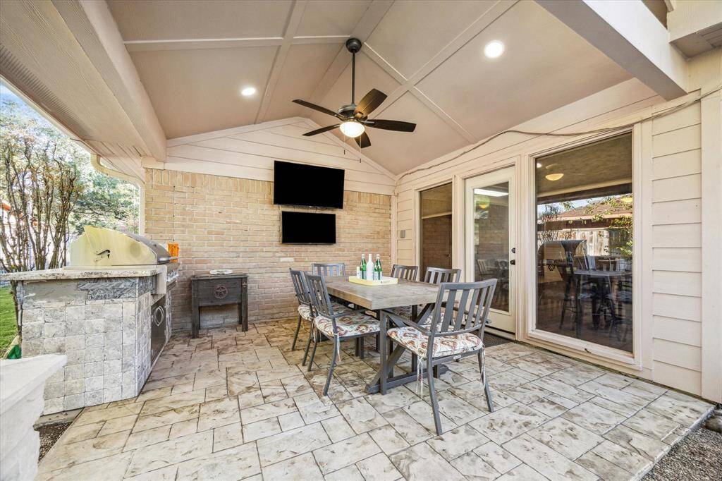 Whether you're hosting lively gatherings or seeking tranquility after a long day, this back yard paradise with a large covered patio and summer kitchen promises to provide the perfect space where memories are made and stress melts away.