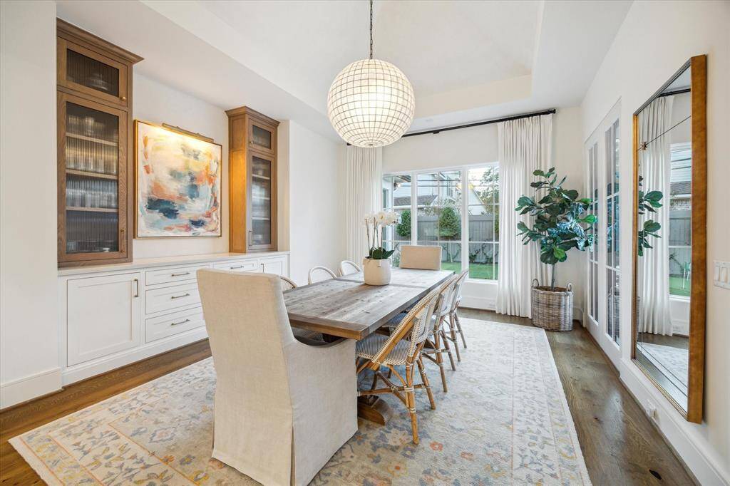 Dining room with dry bar area and custom venetian plaster walls, ideal space for entertaining.