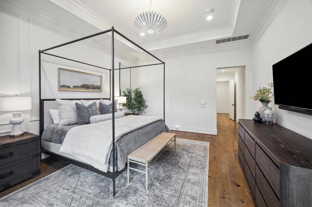 Private hallway leads to primary suite providing privacy and access to primary bath and closet