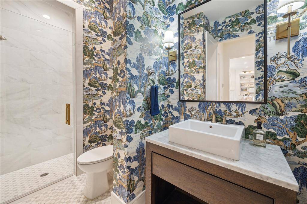 Secondary full bath on first floor, accessible for guests and absolute perfection with Thibaut wallpaper and marble flooring. (Bathroom 2)