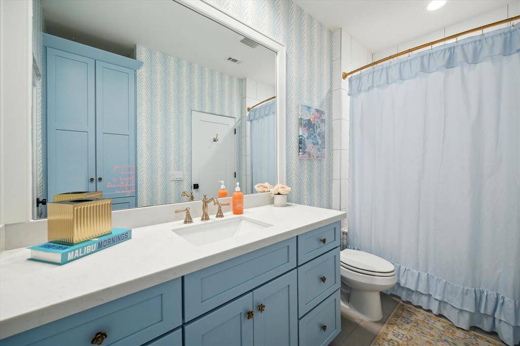 Bathroom 3, ensuite to bedroom 3. Oversized vanity with lots of storage.