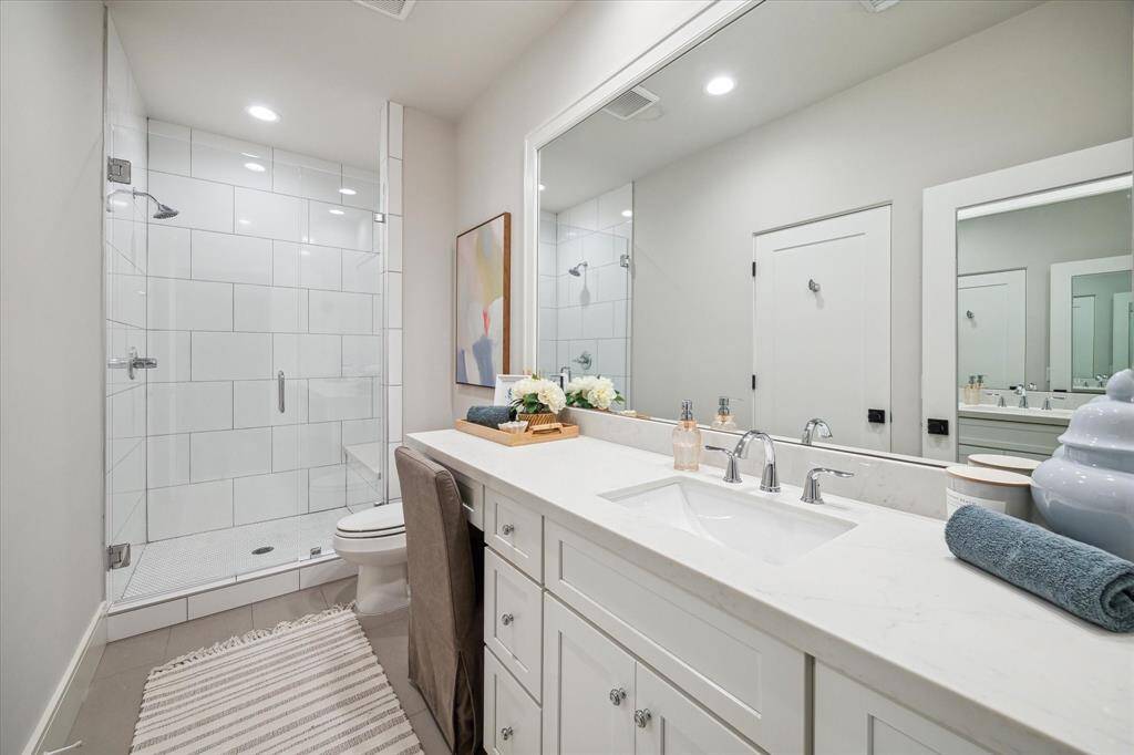 Bathroom 5. Large shower with a built-in vanity.