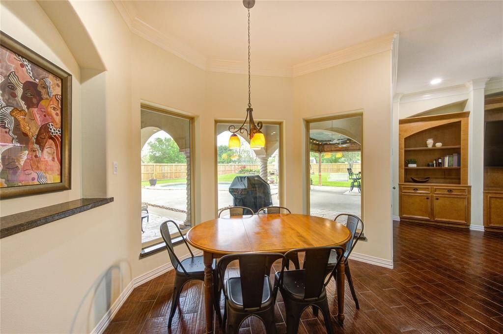 Breakfast area overlooking veranda, pool and beyond.