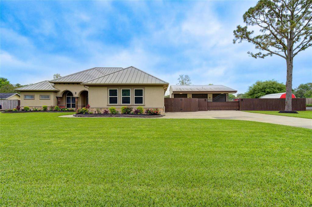 Immaculate home sits on almost an acre! EVERYTHING has been well thought out, planned and designed for a fun, comfortable lifestyle! Home is meticulously maintained and has a 38 kw whole house Generac generator and tankless hot water heater for the workshop.