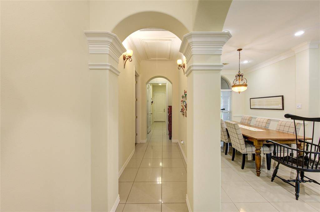 Hallway leading to guest rooms, laundry area and 2 car garage.