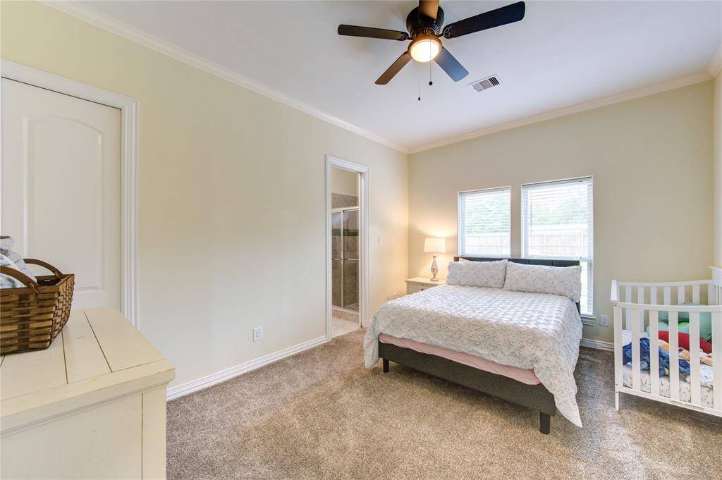 One of (2) additional spacious guest rooms with it's own private bath. Closet with built-ins and pocket sliding door.