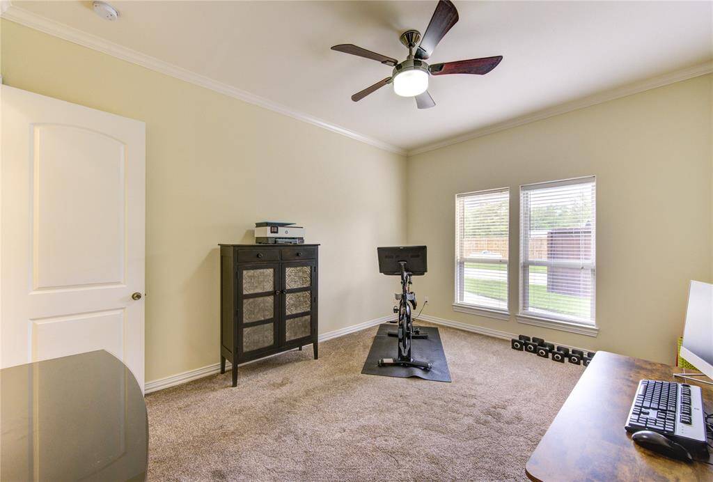 Another guest room currently used as work-out room. This room also has an en-suite bath and closet with built-ins and sliding pocket door entry.