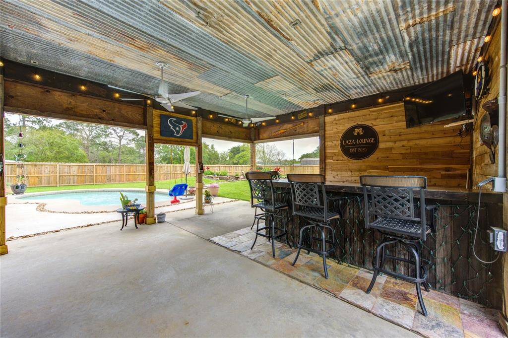 Stop in and sit for a while at this outdoor bar! The tin roof adds to the charm and character!
