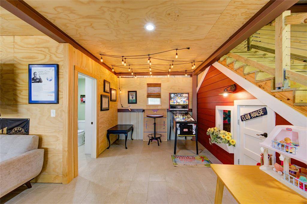 Keeping with the fun theme throughout, the well designed Kiddy Club under the stairway provides hours of entertainment for the little ones! Such a great place to hang out and play! Addition of a full bath to the left!