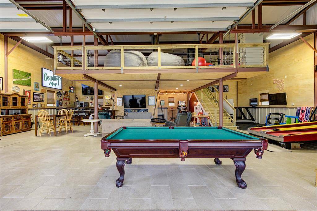 Impossible to capture the essence of this enormous space! Endless possibilities. Workout area to the right of the stairs. Excellent space for classic car enthusiast, boats, RV, lawn equipment and all the toys!