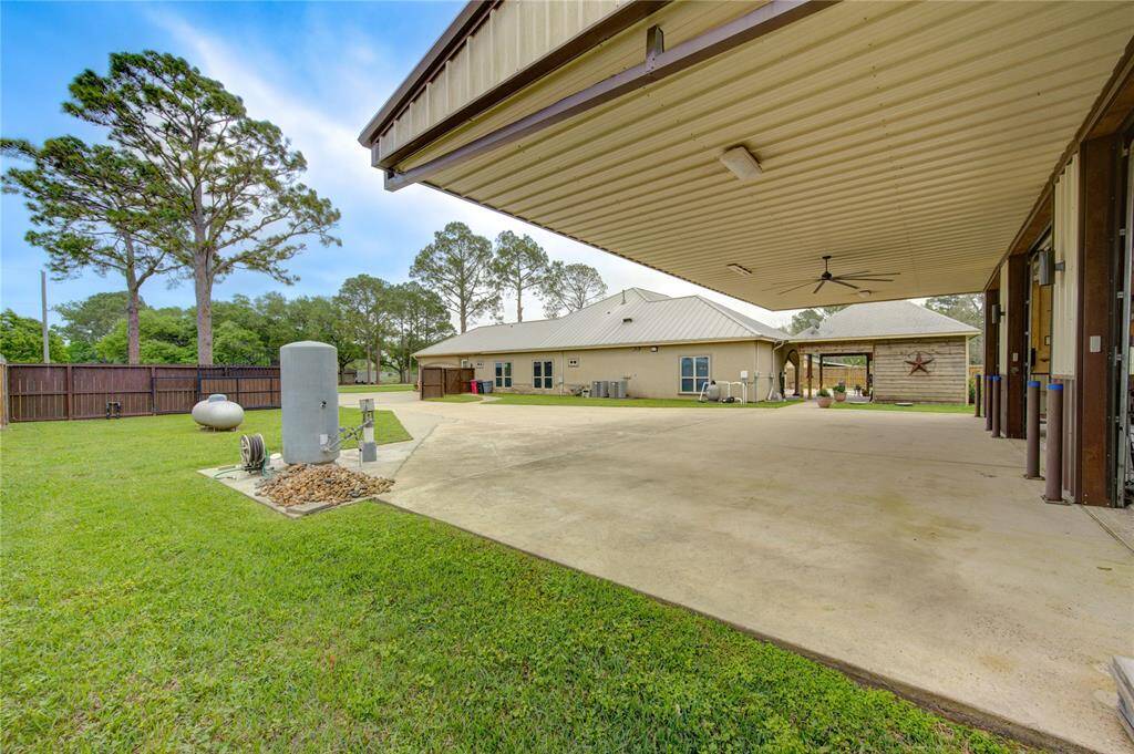 Carport/overhang provides shaded space for more outdoor activities. Additional storage space in overhang. Trim a Seal installed on all driveway expansion gaps.