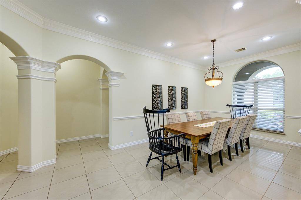 You may not be able to tell by the photos, but this is an extra long table to accommodate large family gatherings. Plenty of space to spare and a lovely view of the front lawn.