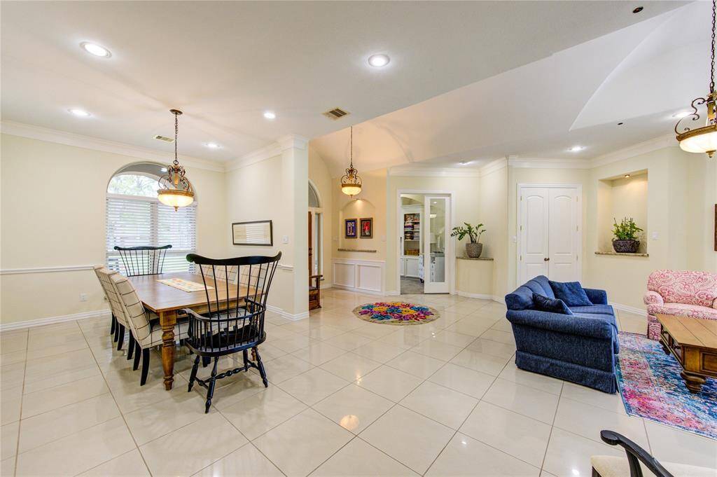 Another view of this massive open space. Recessed lights, double crown moulding and lighted art niches with premium granite allow space to display art work or collectibles. Truly beautiful at any angle.