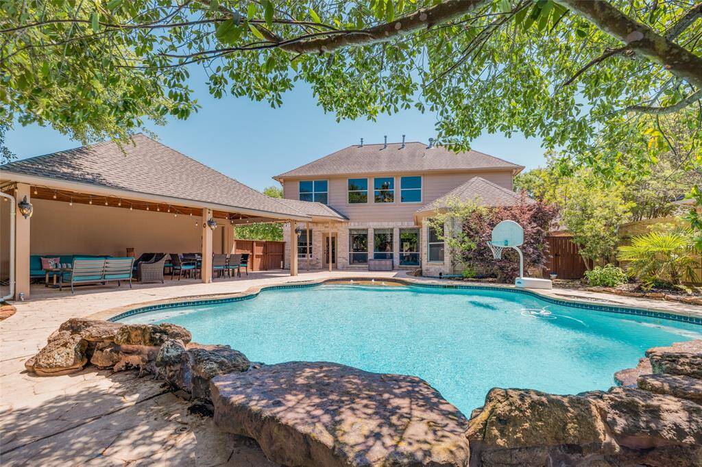 Fabulous quiet, private back yard with huge deep swimming pool with water falls, huge covered patio great for entertaining with family & friends and lots of extra deck space !