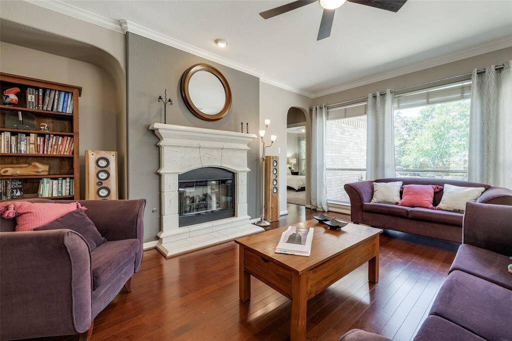 Living room with gas fireplace, 2in blinds, wooden floor