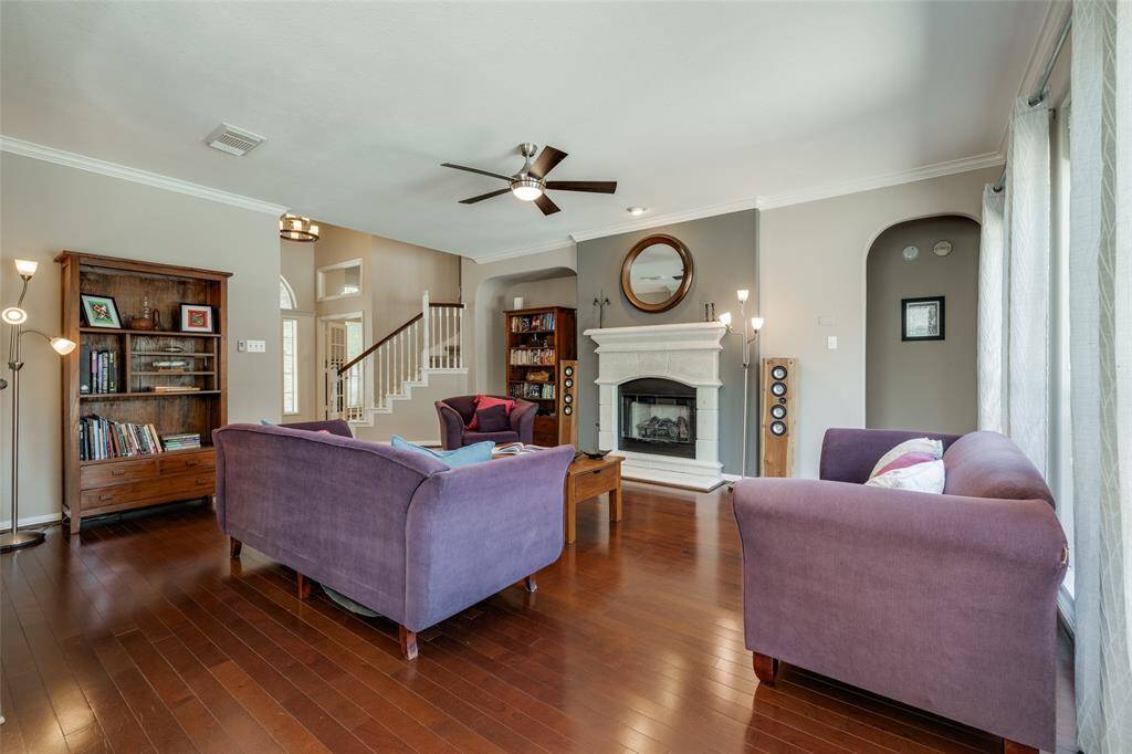 Living room with door through to Primary on first floor, gas fire, hardwood floors