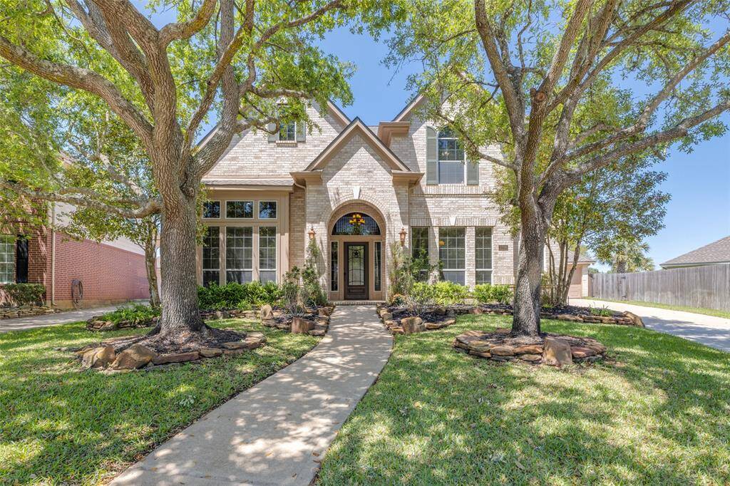 Beautiful Newmark 4 bed, 3/2 bath home on one of the largest lots in the subdivision! Large detached garage with outside bathroom and 2 car garage, lots of off street parking - backs onto bayou with gate to walking & bike trail to Katy ISD schools