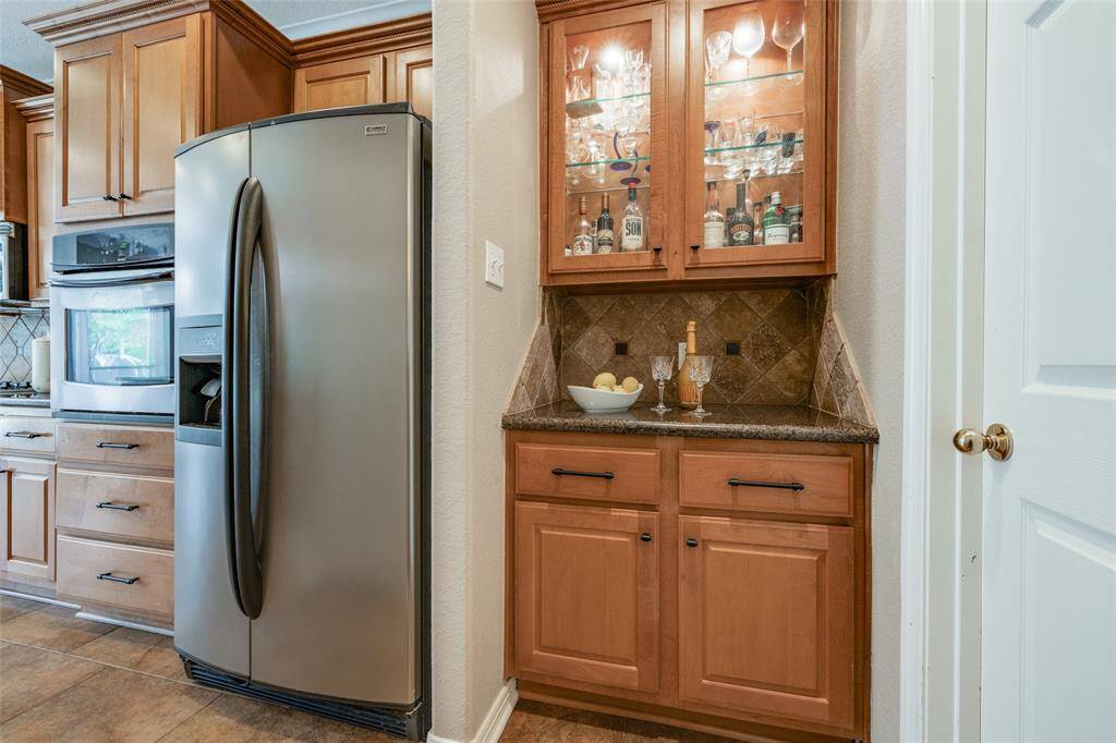 Kitchen with lots of cabinets, granite counter, SS appliances, Butlers Pantry