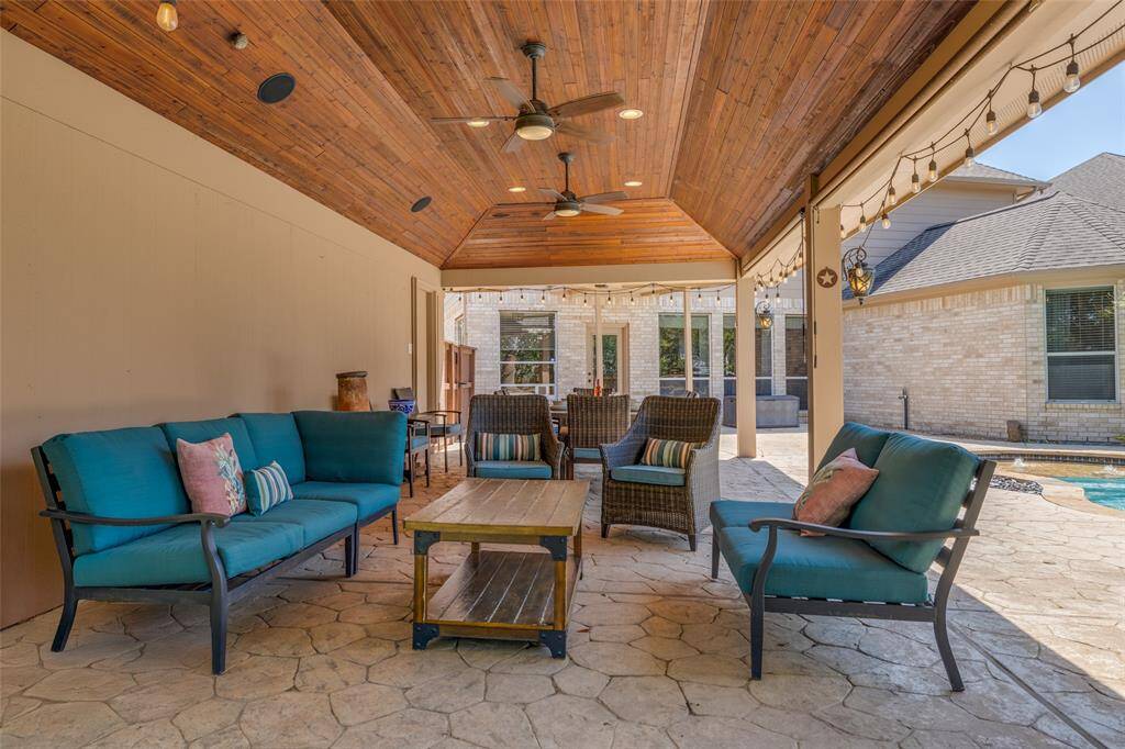Huge covered wood clad ceiling patio - great for entertaining with family & friends, ceiling fans, half bath in the garage close by !