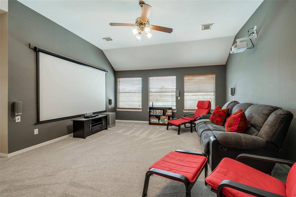 Huge Game Room wired for projector, screen and speakers - current equipment is excluded from the sale, ceiling fan, 2 in blinds