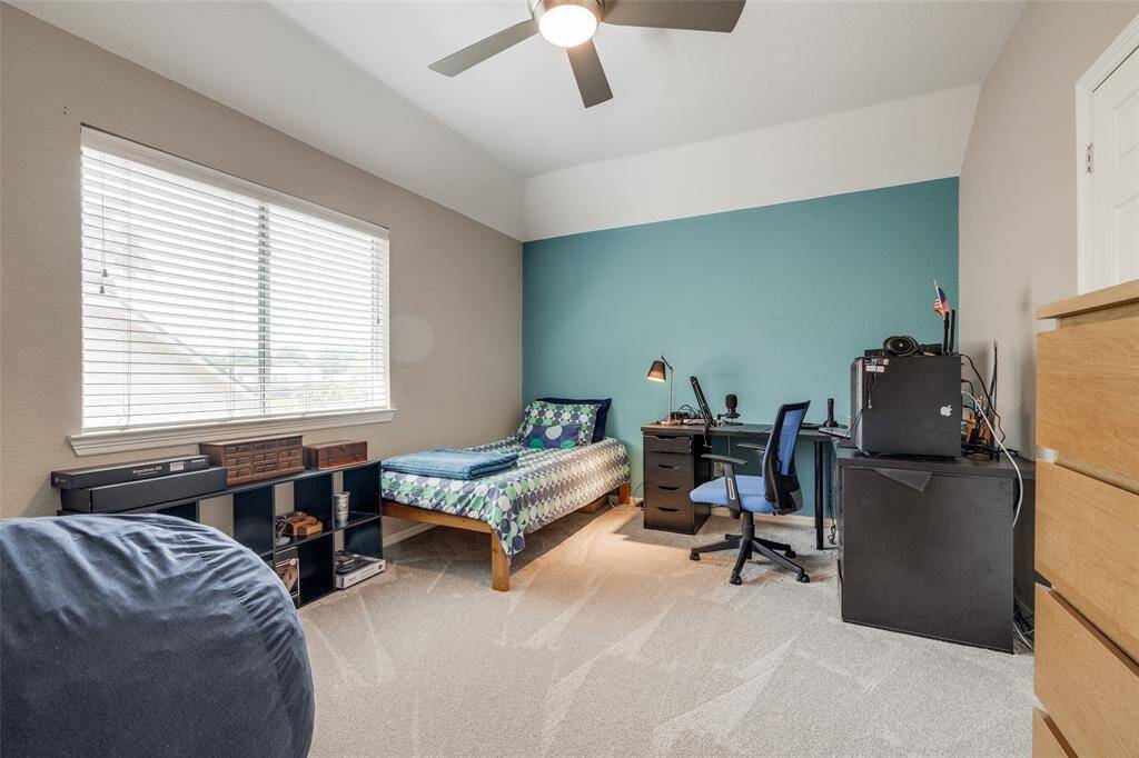 Bedroom 2 with en suite bathroom, carpet 2024, ceiling fan, 2 in linds