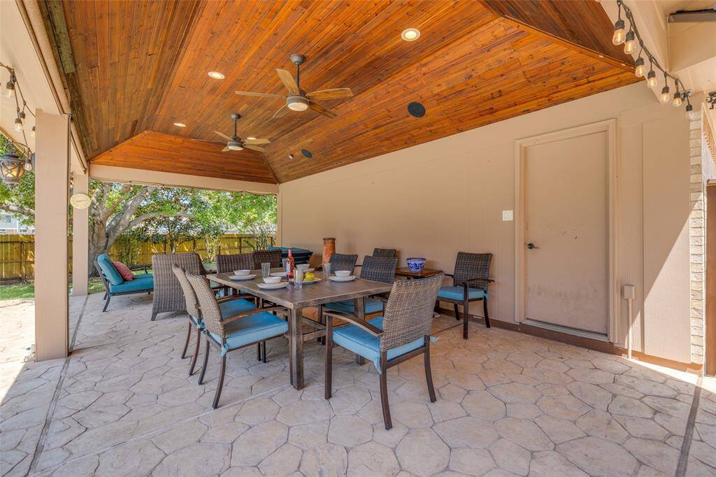 Huge covered wood clad ceiling patio - great for entertaining with family & friends, ceiling fans, half bath in the garage close by !