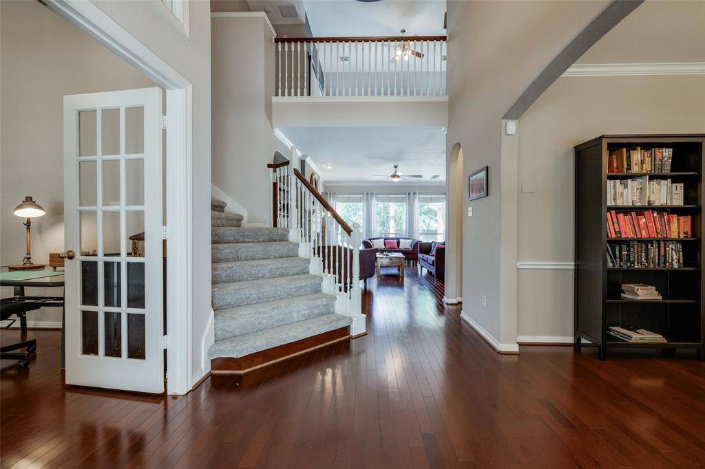 Beautiful curved stairs up to 3 further bedrooms & large game room & 2 bathrooms