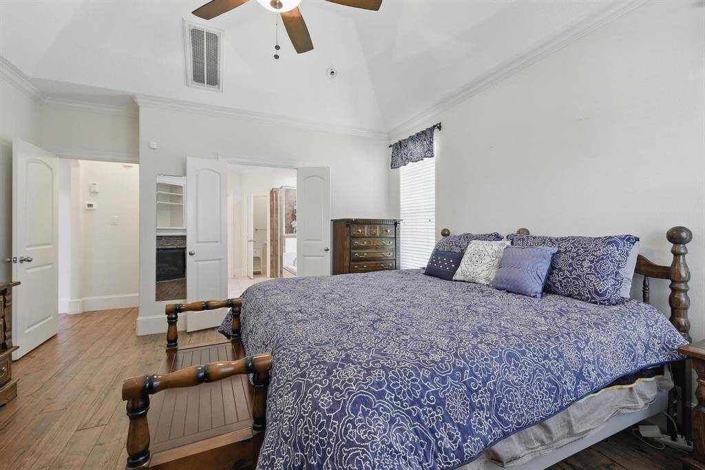The primary bedroom flows into a private ensuite bath, offering comfort and convenience just steps away.