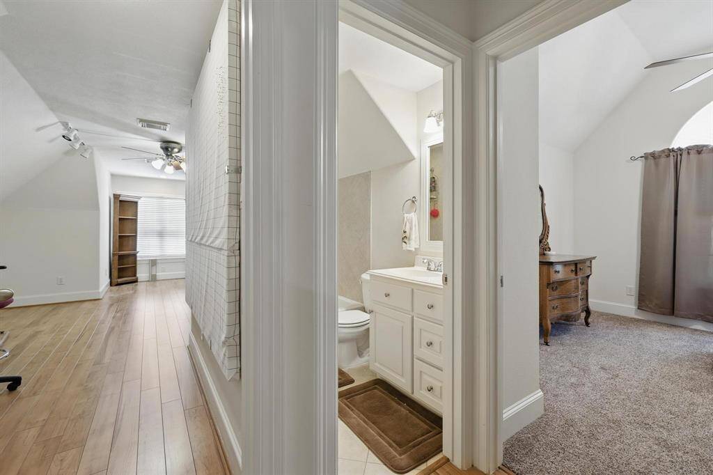 Upstairs, you'll find a well-appointed shared bath conveniently located for guest and family bedrooms alike.