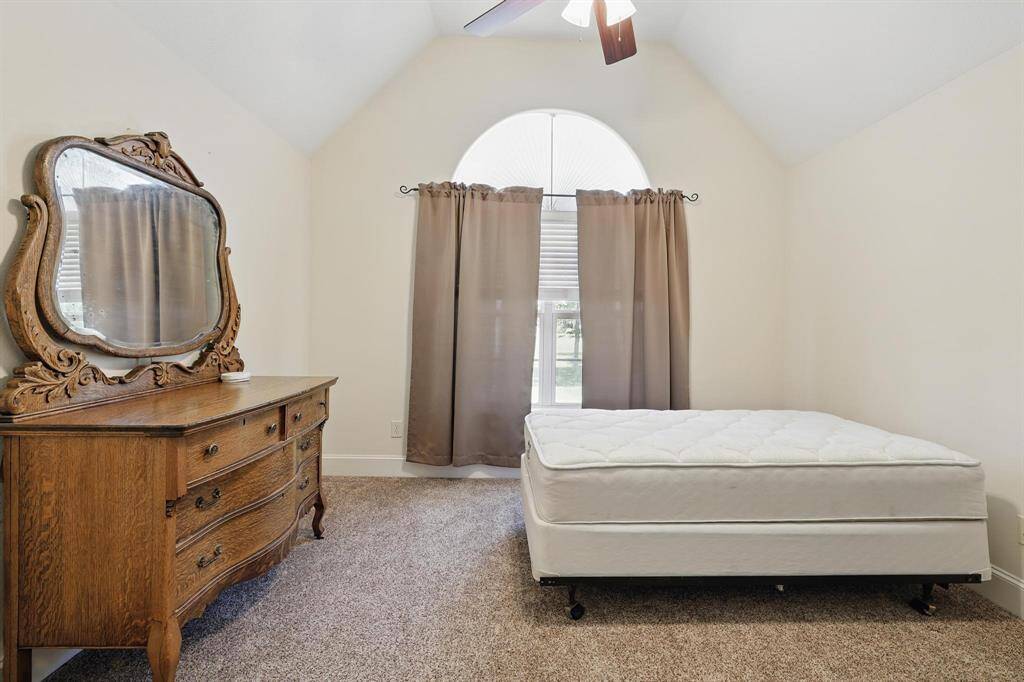 Upstairs bedroom filled with abundant natural light, creating a bright and welcoming space.
