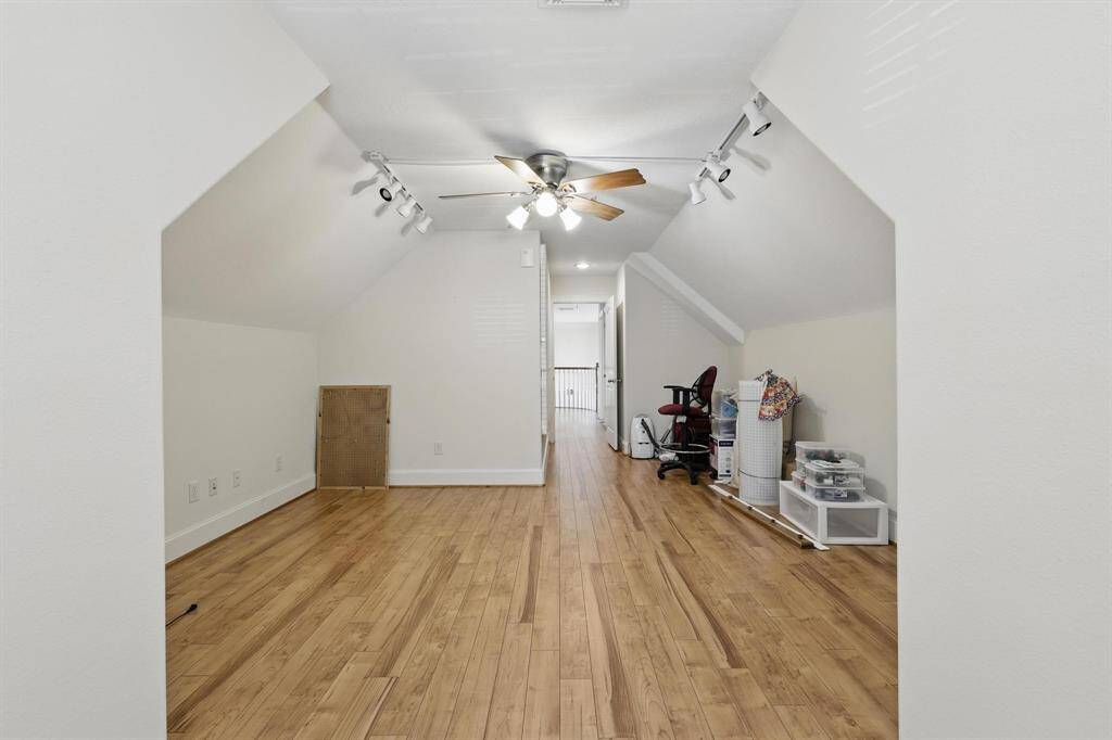 This upstairs bonus room offers flexible use—perfect for gaming, extra storage, or even as an additional bedroom to suit your needs.