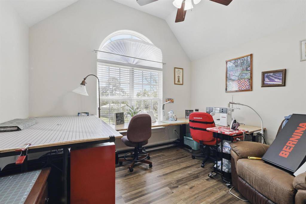 This upstairs bedroom offers versatile functionality—perfect for a guest room, hobby space, or home office. As shown, it was previously used as a sewing room, showcasing its flexibility to fit your lifestyle.