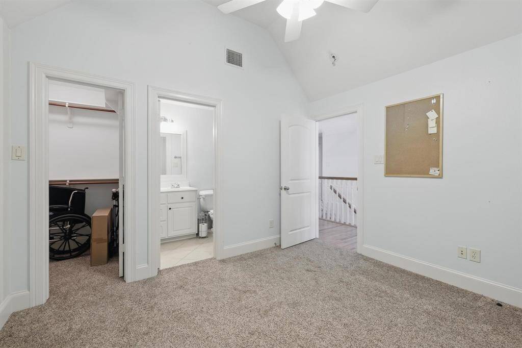 This upstairs bedroom includes its own full bath, offering added comfort and convenience—perfect for guests or multigenerational living.