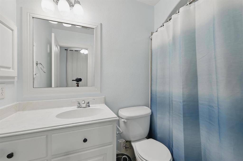 The upstairs bath features a convenient tub and shower combination, perfect for both quick rinses and relaxing soaks.