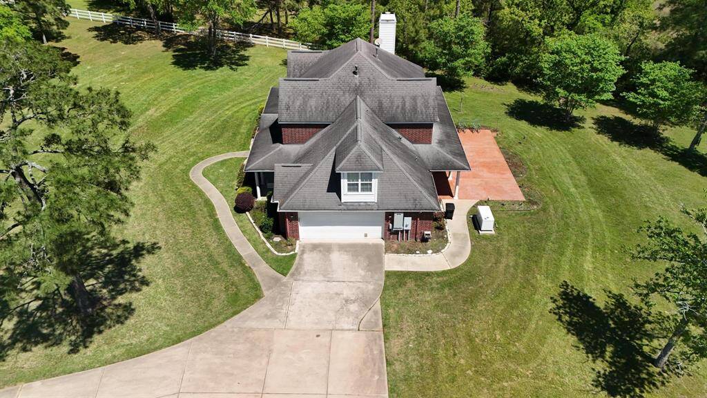 That oversized driveway is such a great touch! It must make hosting family and friends so much easier, with no worries about squeezing everyone in. And the way the home is surrounded by nature really creates that perfect balance of convenience and serenity. The natural surroundings probably make it feel like you're tucked away in a quiet retreat, but still have plenty of space for everyone to gather.