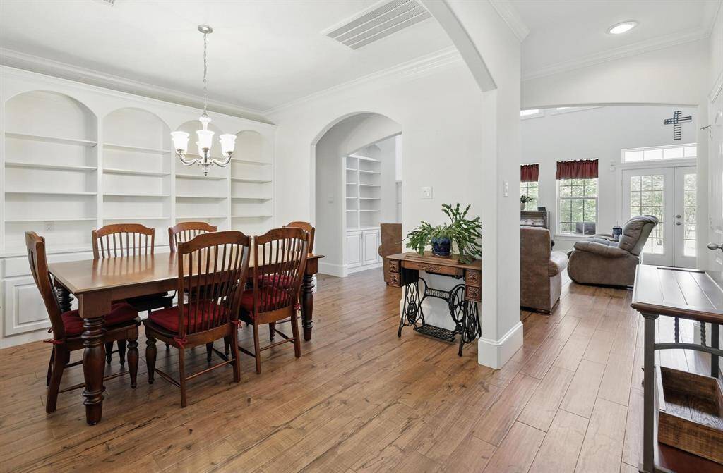 Beautiful built in show case this formal dining room as is streams seamlessly into the great family room providing an open concept.