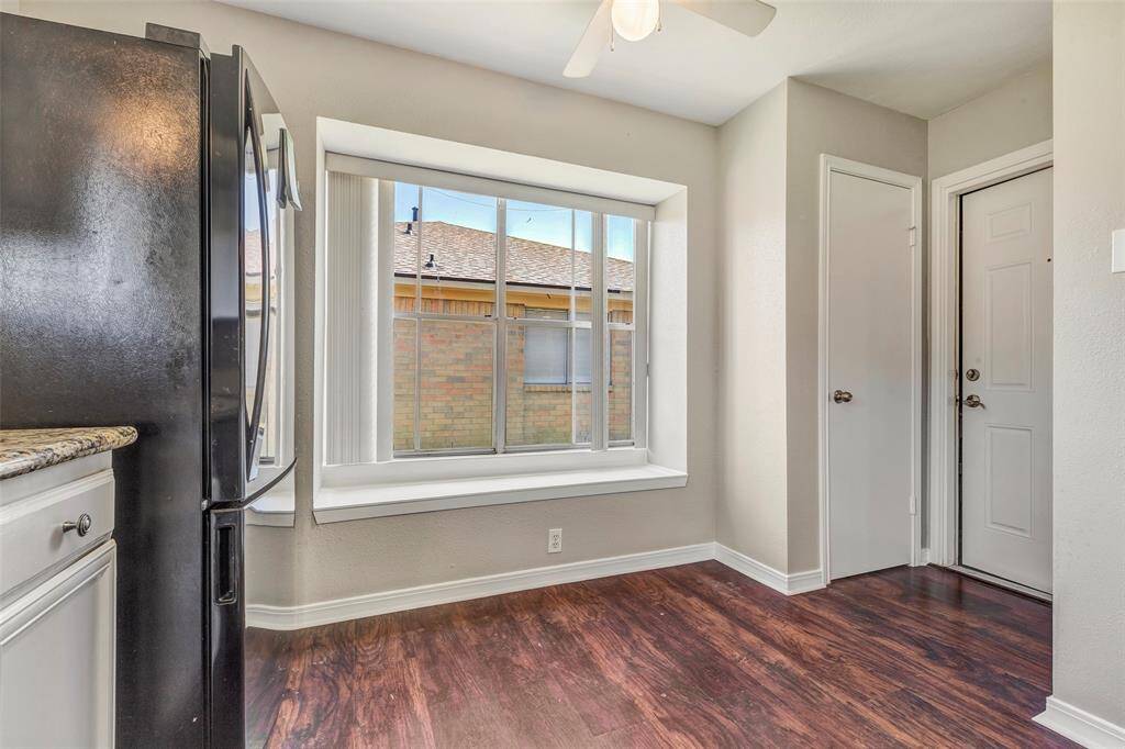 Additional kitchen space with a pantry conveniently located behind the closed door, offering ample storage for all your culinary needs.
